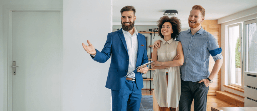 Realtor showing young couple a home for sale