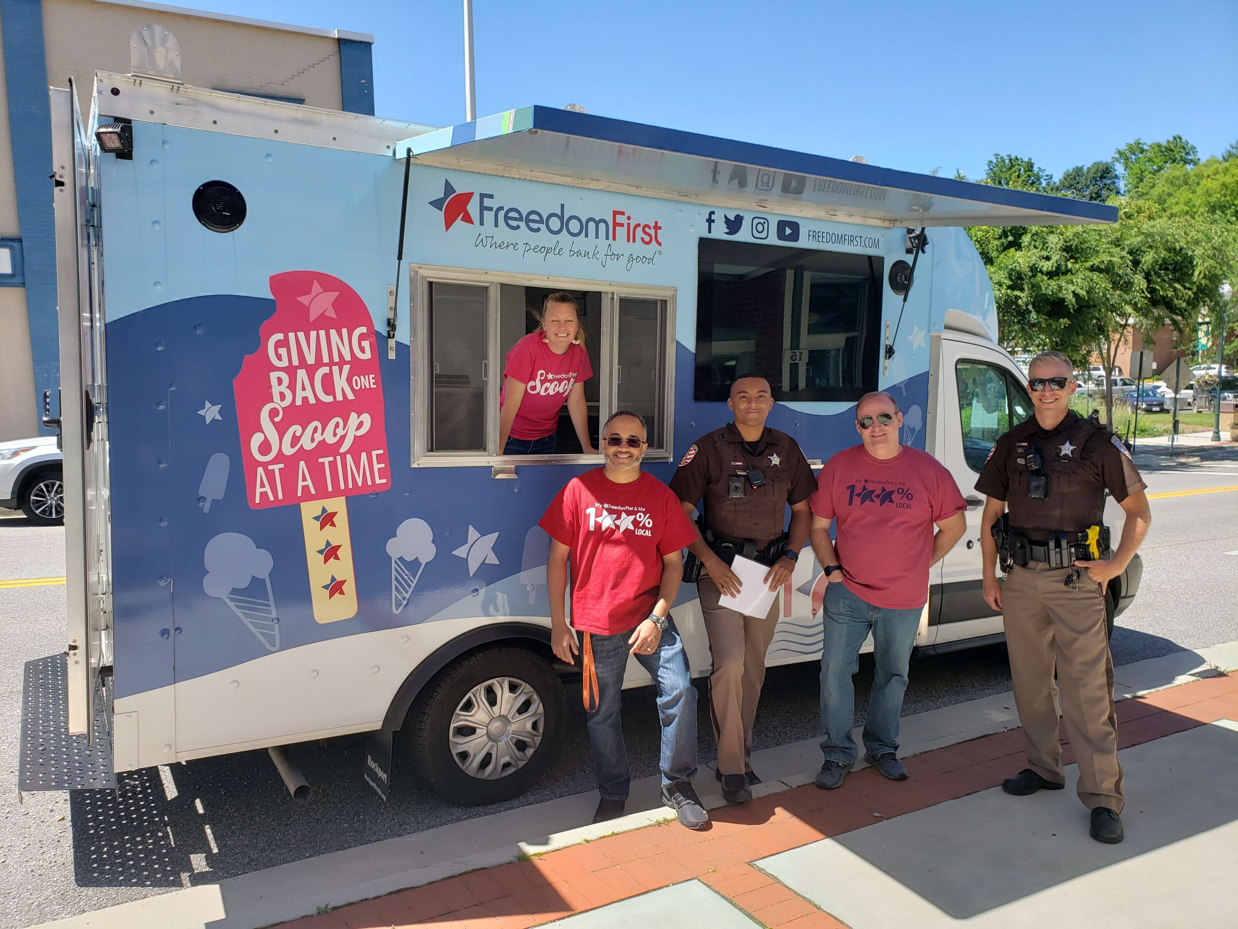 Freedom First employees working on Scoop